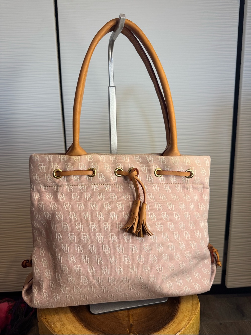 Dooney & Bourke Monogram Pink Tote with Leather Accents, Handles and Tassel.